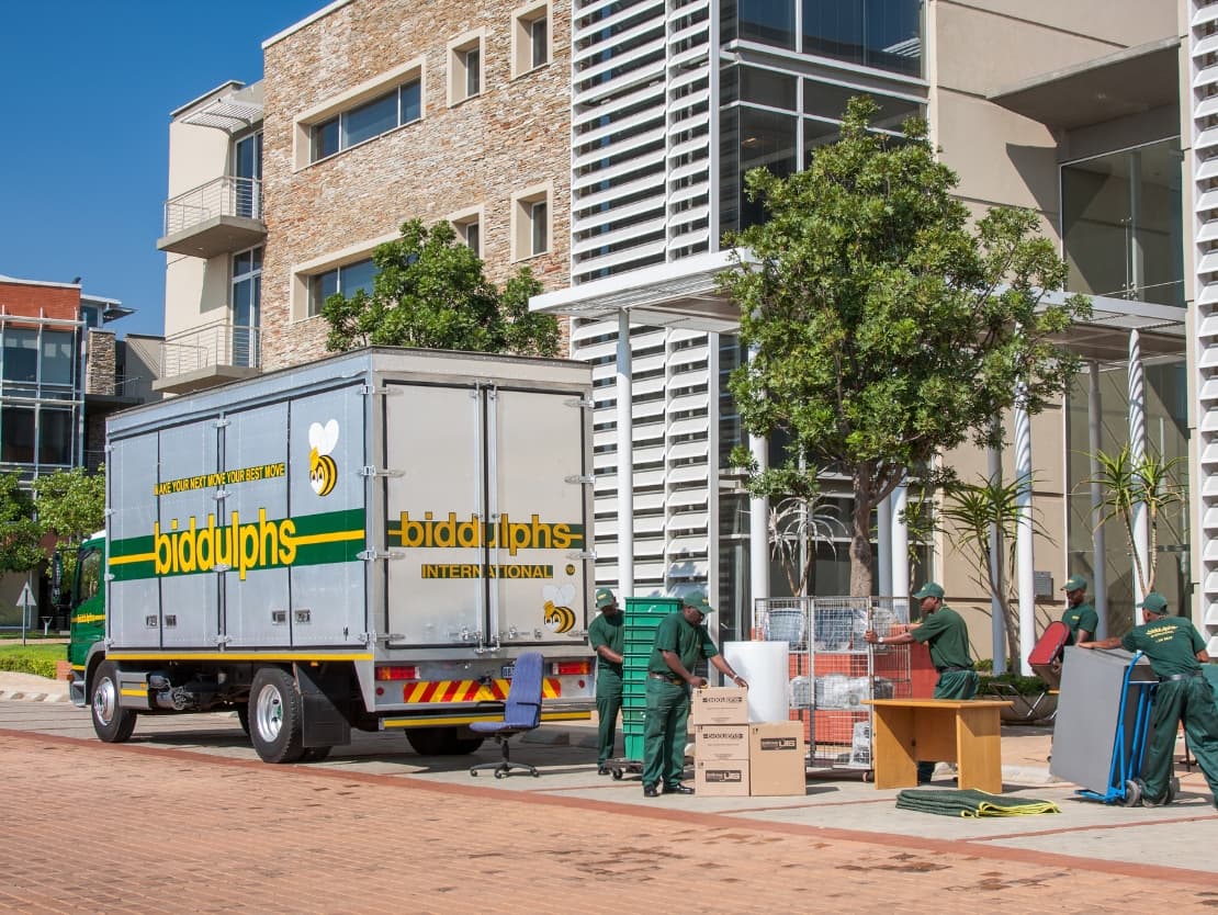 The Biddulphs crew moving office furniture outside an office building
